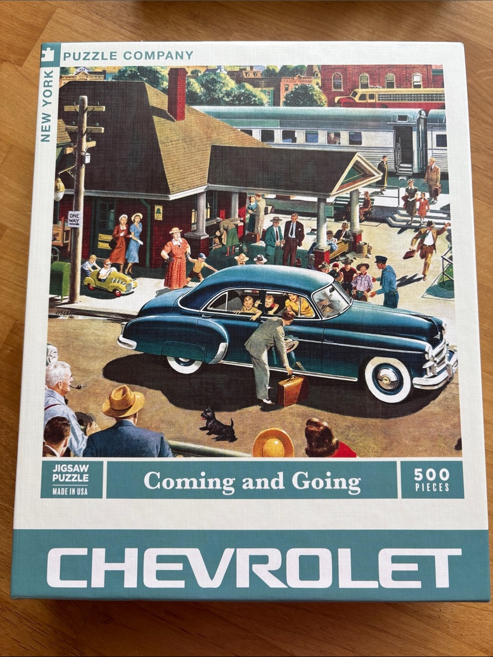 New York Puzzle Company Coming and Going 500 Piece Puzzle